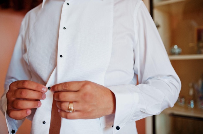 buttoning white dress shirt