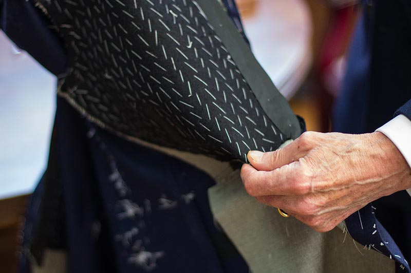 A person touching a fabric