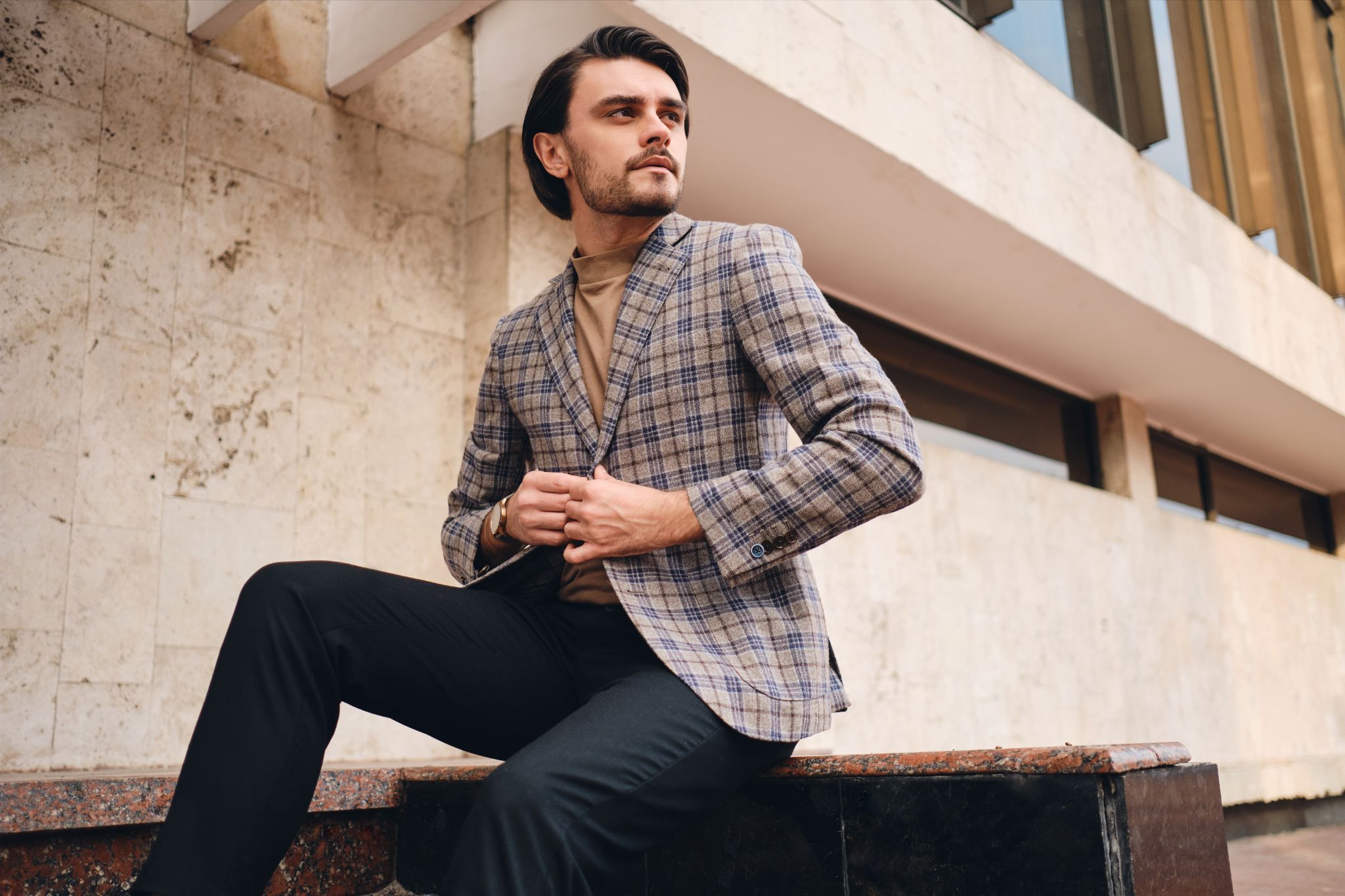 person wears plaid coat 